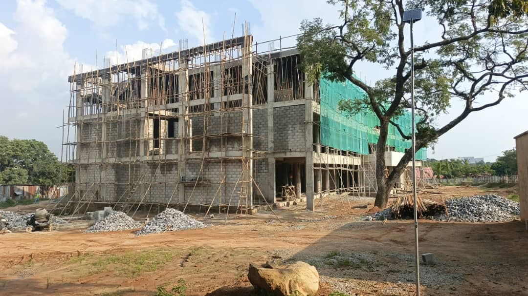 Block walls rising with scaffold up